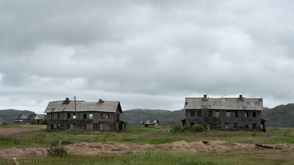 View of an old abandoned dilapidated wooden house