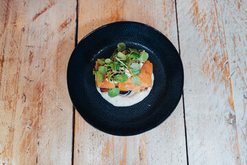 Healthy salmon dish on a rustic wooden table