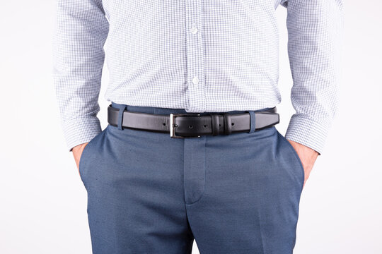 male model looks leather belt with hands in pocket