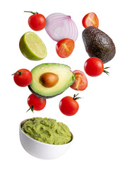 Guacamole bowl with flying ingredients, avocado, lime, onion, tomato