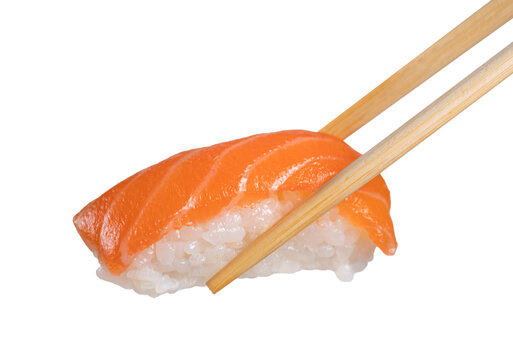 chopsticks holding a piece of nigiri