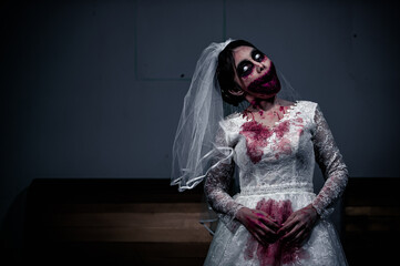 Halloween festival concept,Asian woman makeup ghost face,Bride zombie charactor,Horror movie...