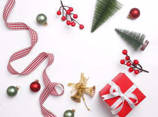 Christmas festival mock up. Flat lay setup of Christmas props. Xmas props like Jingle bells, Christmas tree, Gift boxes.