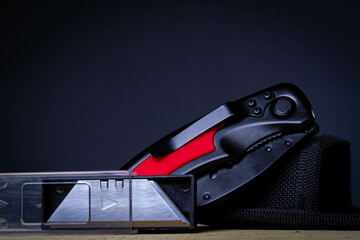 Universal powerful knife. Folding tool that cuts paper, plastic, cardboard and other dense materials.