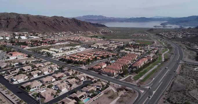 Boulder City in Nevada, United States, Lake Mead in Background. Boulder City is one of only two cities in Nevada that prohibits gambling. Architecture, Mountains and Road in Background