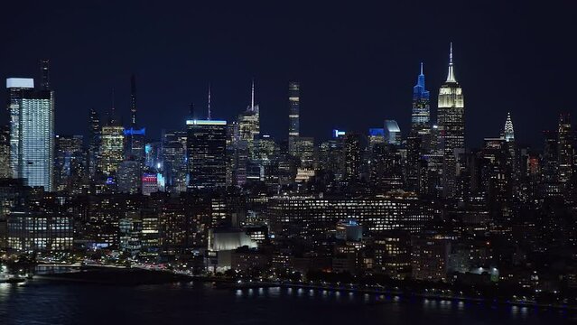 
Beautiful Aerial View of Famous Buildings in Midtown Manhattan. Hudson River and New Jersey Skyline in the Background. High Quality Footage Shot from Helicopter. New York City, United States. 