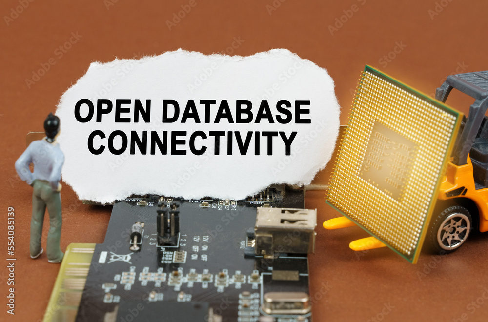 Fototapete on the board with microcircuits lies a paper plate with the inscription - open database connectivity