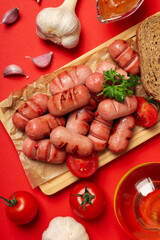 Concept of tasty food, grilled mini sausage, top view