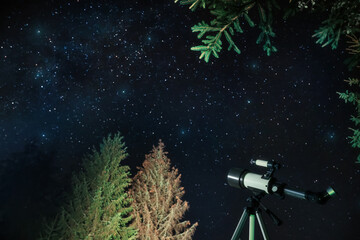 Modern telescope and beautiful sky in night outdoors. Learning astronomy