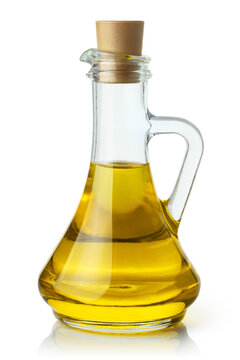 Delicious olive oil in a glass bottle, isolated on white background