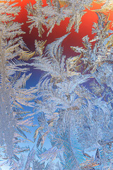Winter Icy and Frosty Patterns on the Window Glass.  Background for Christmas and New Year. Macro Close Up