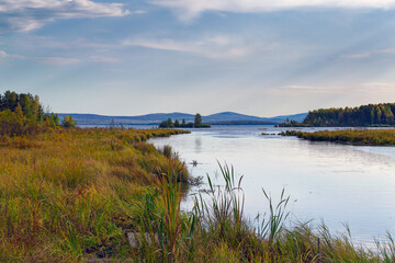 Autumn landscape sunset on the river bank. Wonderful nature, beautiful natural background.