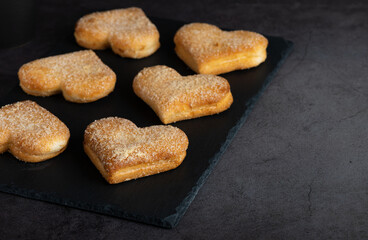 Heart shaped biscuits on cutting board