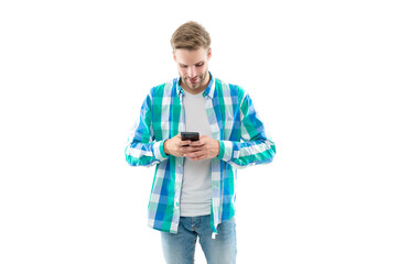 busy man texting on phone wearing checkered shirt. photo of man texting on phone device