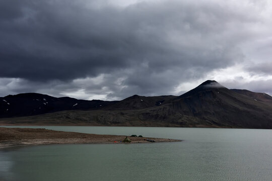 View looking across at the teams base camp on the banks of lake Centrum S��. The larger triangular tent known by the team as the 'wigwam' (Wigwam camp) was used as a general communal space where the t