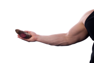 Strong, fit, muscular man holding two beets in his right hand. One full beetroot and one cut in half. Transparent PNG