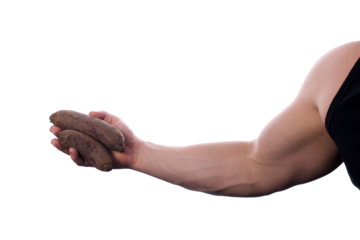 Strong, fit, muscular man holding two beets in his right hand. One full beetroot and one cut in half. Copy space around. Transparent PNG