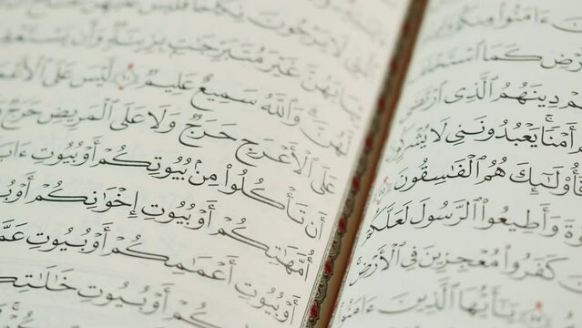 The Holy Quran Book, koran Chapter, flipping pages Close up Macro.