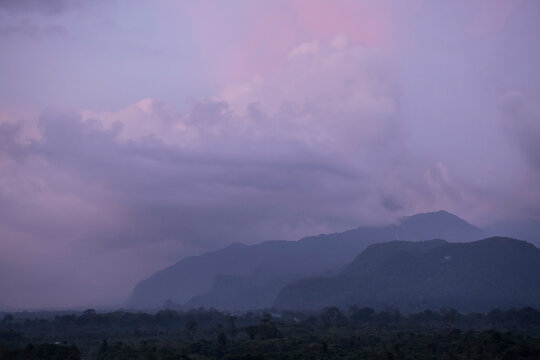 Dramatic clouds at sunset over the rainforest and mountains of Gunung Mulu National Park; Sarawak, Borneo, Malaysia
