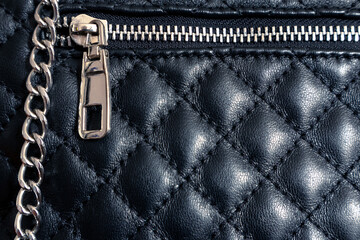 Black leather bag with a clasp. Elegant bag with a zipper © Klochkov