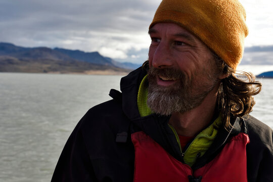 Portrait of chief boatman and reliable expedition member. Photograph taken whilst he was in total control of the Zodiac 3 inflatable boat on lake Centrum.