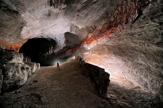 A Mulu Cave Project expedition member in the 1954 fossil passage in Whiterock Cave.