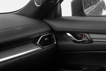 Obraz na płótnie Canvas Modern car interior details. Car wooden panel. Interior of prestige modern car.