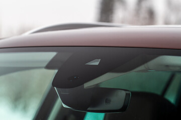 Windshield rain and light sensors of modern car. Car rain sensor.