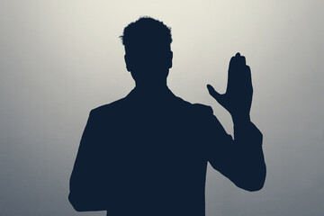 Unknown male silhouette making a promise or oath. I will tell only the truth - obrazy, fototapety, plakaty