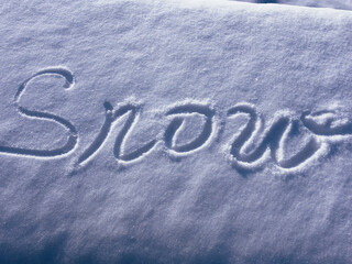 inscription on the snow. the inscription "snow" on white. winter landscape