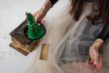 old magical book. the witch performs a black ritual. witchcraft and mysticism. green candles