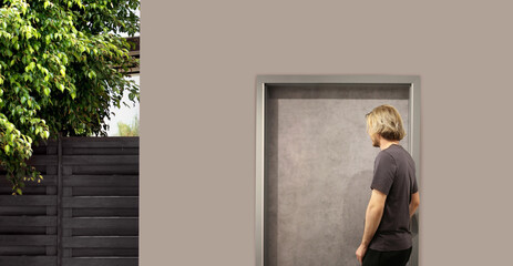 Fototapeta premium young man opening the door of his house.Inviting the guests