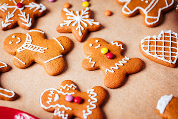 Various selection of Gingerbread cookies with sugar icing. Decorated in Christmas spirit. Happy New Year celebration. Playful and fun. 
