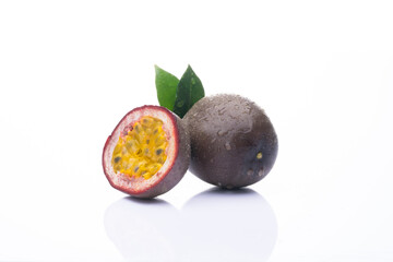 Passion fruit ( Maracuya ) with green leaves isolated on white background