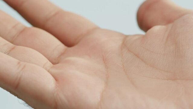 Human hand with lines, Palm reading, foretelling the future through the study of the palm, close up macro