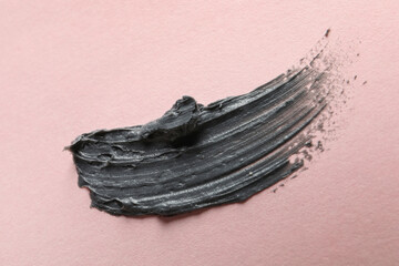 Sample of face mask on pink background, top view