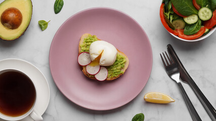 Delicious sandwich with boiled egg served on white marble table, flat lay