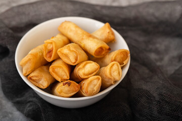 Spring Roll also known as Egg Roll on white dish
