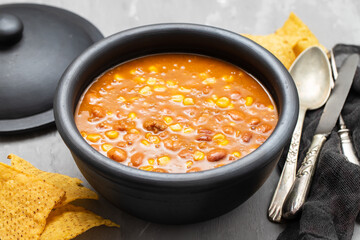 Mexican typical dish Chili Con Carne on black dish