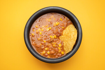 Mexican typical dish Chili Con Carne on black dish