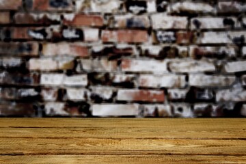 Old wooden table and brick wall. Empty wooden table top with old brick wall background. Rustic wooden board . Product display template.
