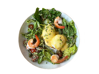 Cooking breakfast - eggs Benedict with hollandaise cheese sauce, toast and fresh salad by chef hands on restaurant or cafe background. Top view