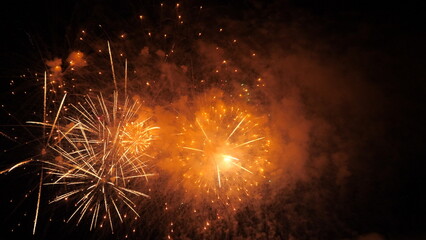 4k. Bright New Year's fireworks 2023. beautiful new year's eve. glowing loop christmas bokeh....