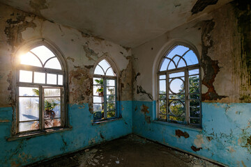 Old shabby room of abandoned mansion in gothic style