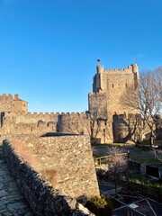 Fototapeta na wymiar Castle of Bragança, under sunset light, blue sky