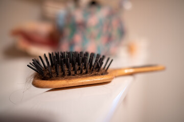 wooden hair brush in a bathroom
