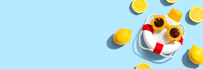 Summer sunblock sunscreen skincare theme with liferaft and lemons for vitamin c concept