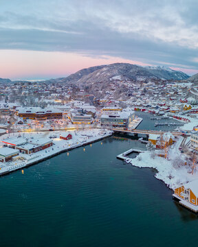 Sunset over the snow covered town center of Os&oslash;yro, Bj&oslash;rnafjorden, Norway