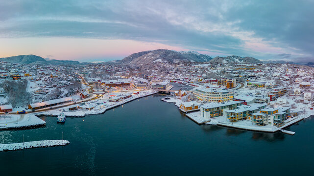 Sunset over the snow covered town center of Os&oslash;yro, Bj&oslash;rnafjorden, Norway