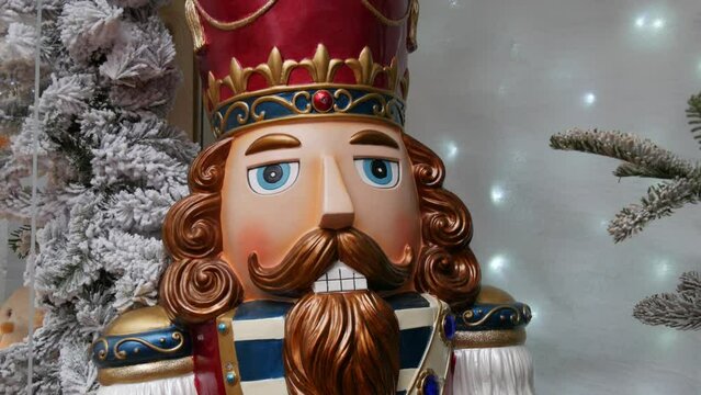 Christmas nutcracker on the background of New Year holiday decorations